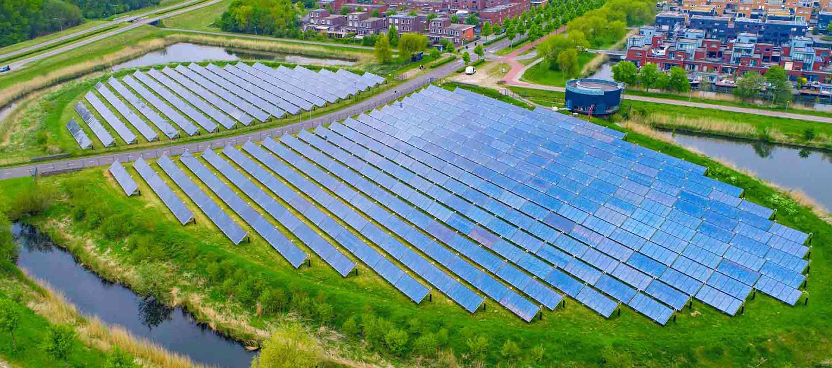 Solar panels aerial view. Innovative solar panel island in Almere, Netherlands. Modern sustainable residential area.